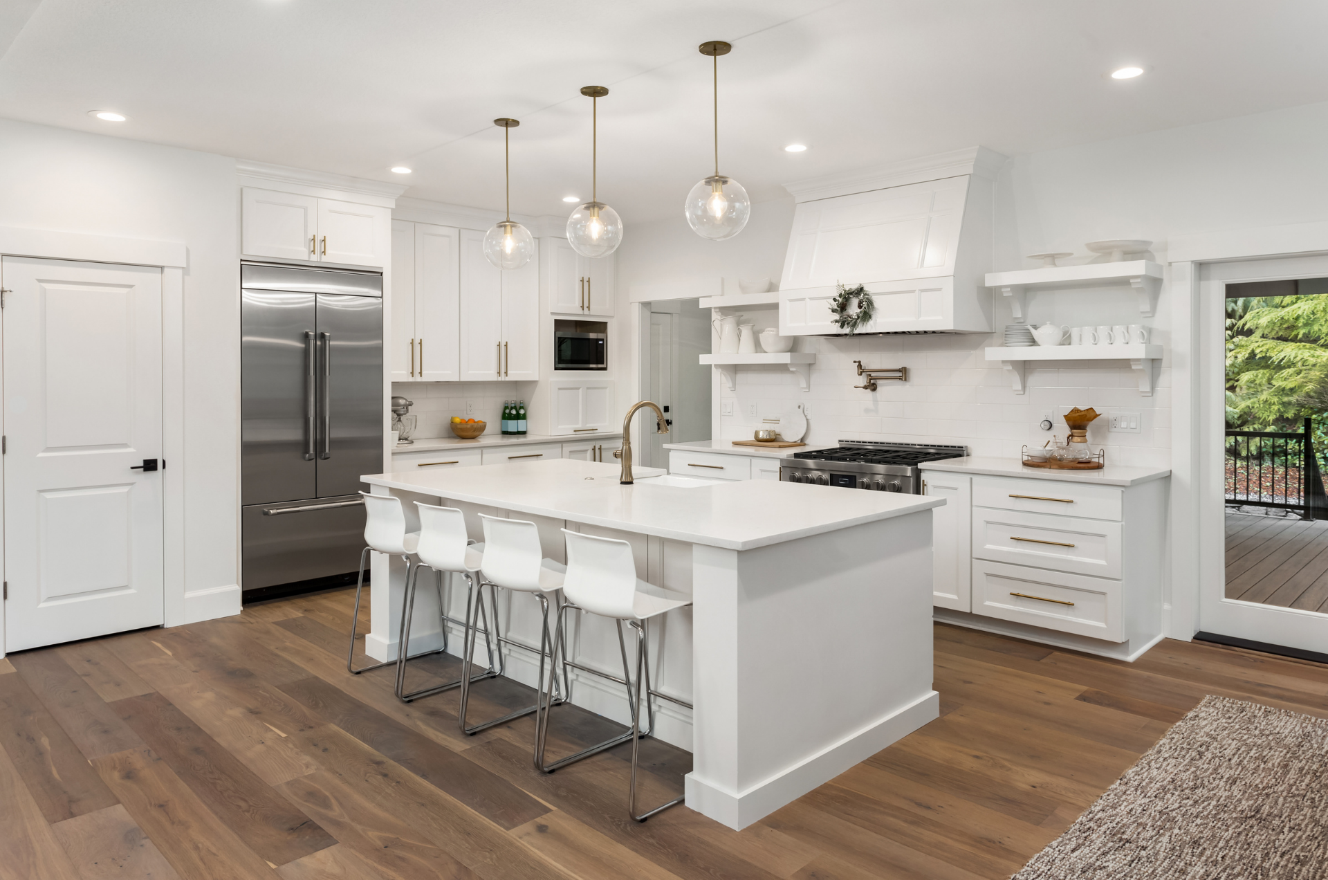 TMDC group Kitchen Remodel with white subway tiles hardwood flooring and pot filler